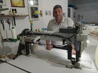 Glaros Sails Rhodes | Kyriakos Malapetsas on the high-long aarm sewing machine |www.sailmakerrhodes.com